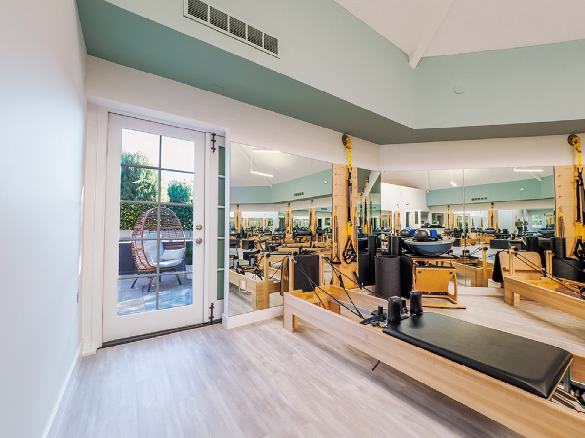 Pilates studio mirrored wall and flooring installation